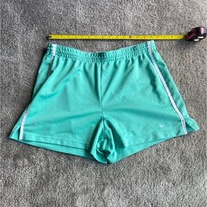 Women’s Nike shorts in sea-foam green with white trim